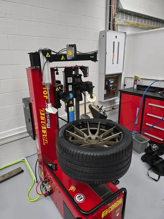 A tyre being fitted on the machine at Tyre Lab