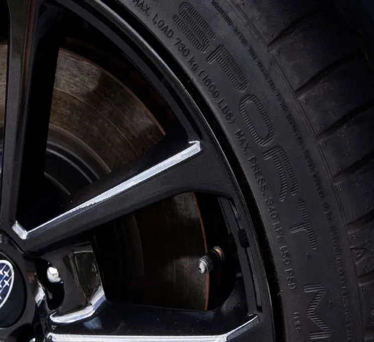 A kerbed alloy wheel rim, after the repair