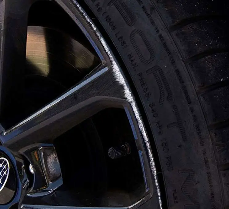 A kerbed alloy wheel rim, before the repair