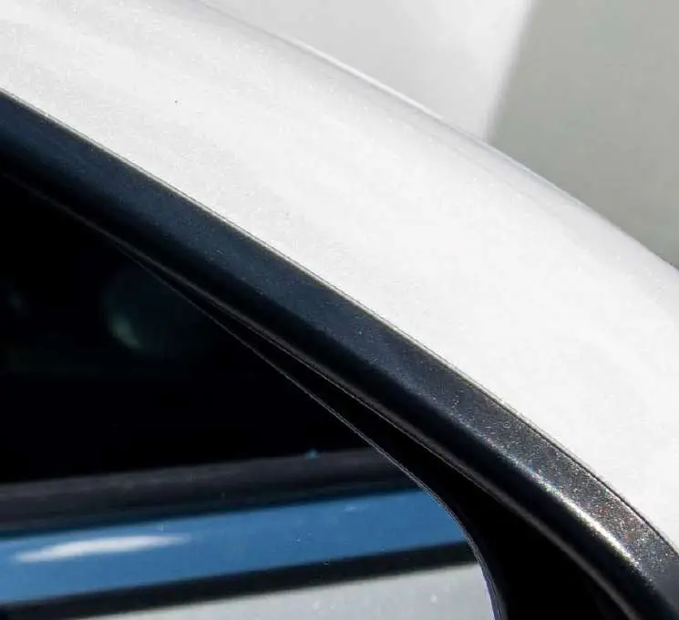 A chipped white mirror casing, after the repair